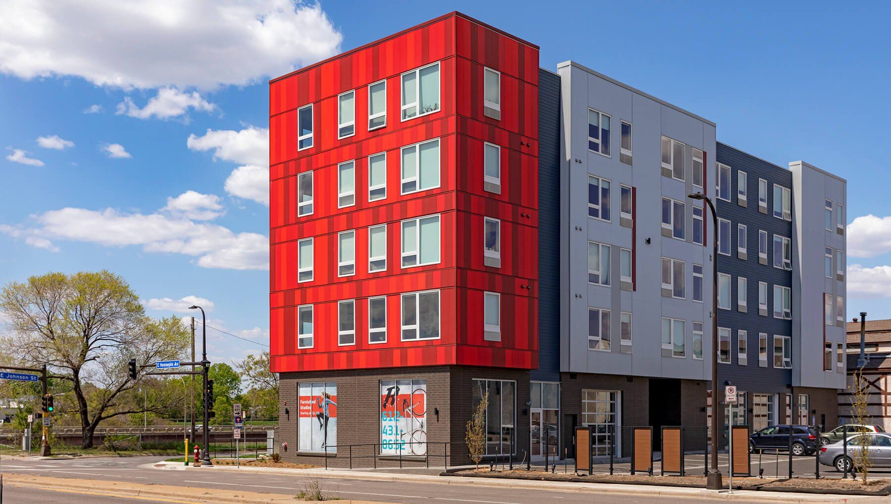 Rym Apartments exterior parking lot view