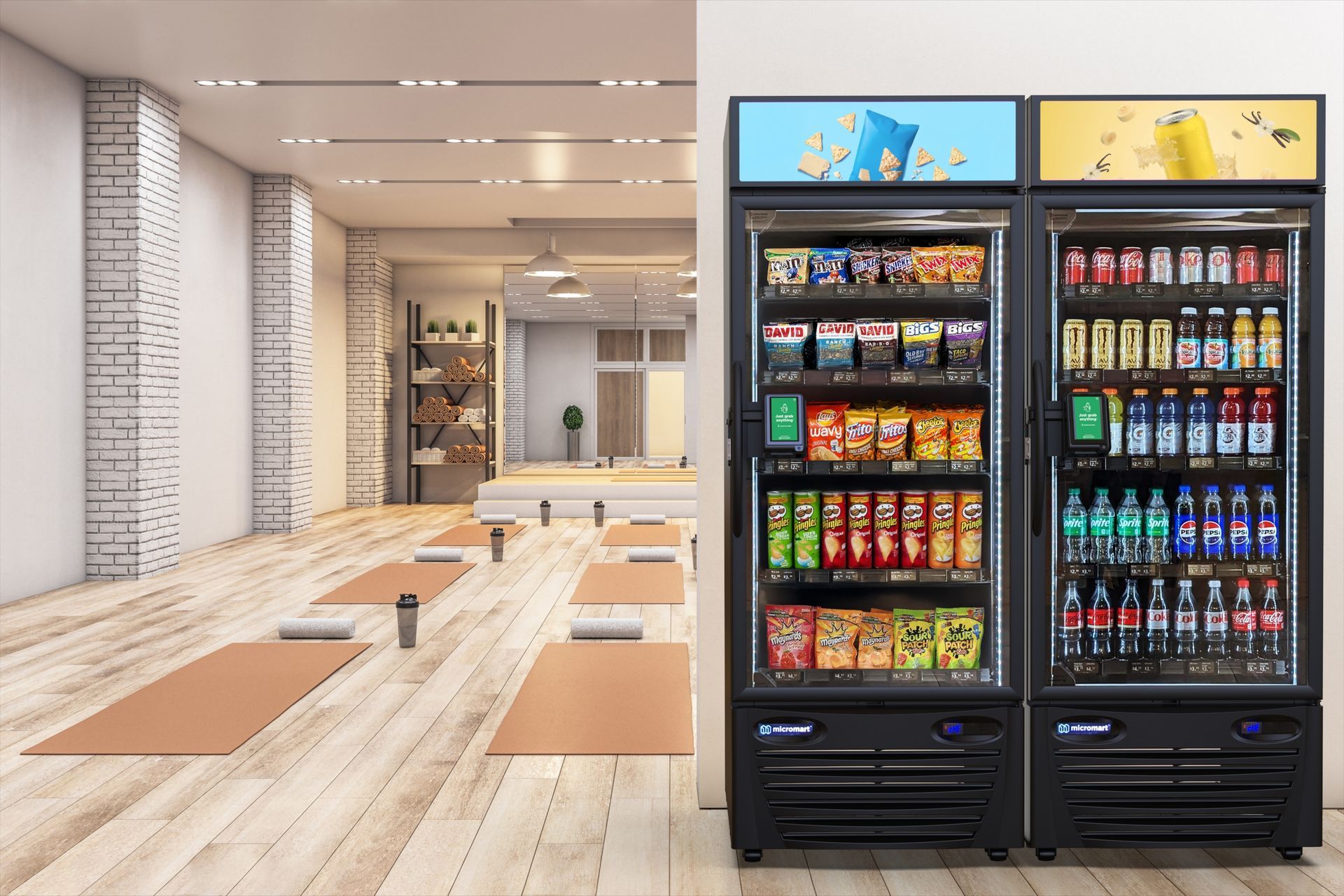 Bright lobby with wooden benches and two black vending machines stocked with snacks and drinks.