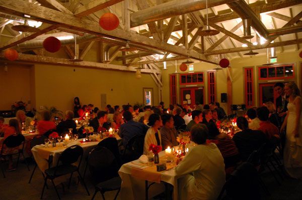A large group of people are sitting at tables in a large room