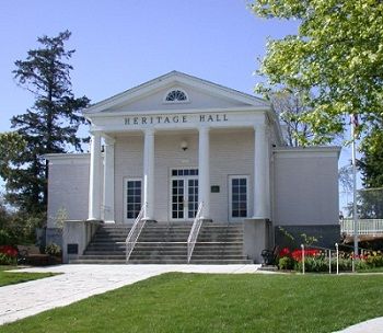 A large white building with the word heritage hall on it