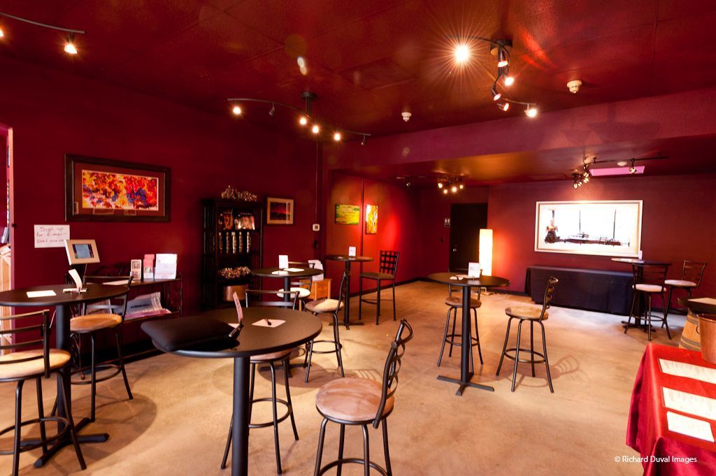A large room with tables and chairs in it