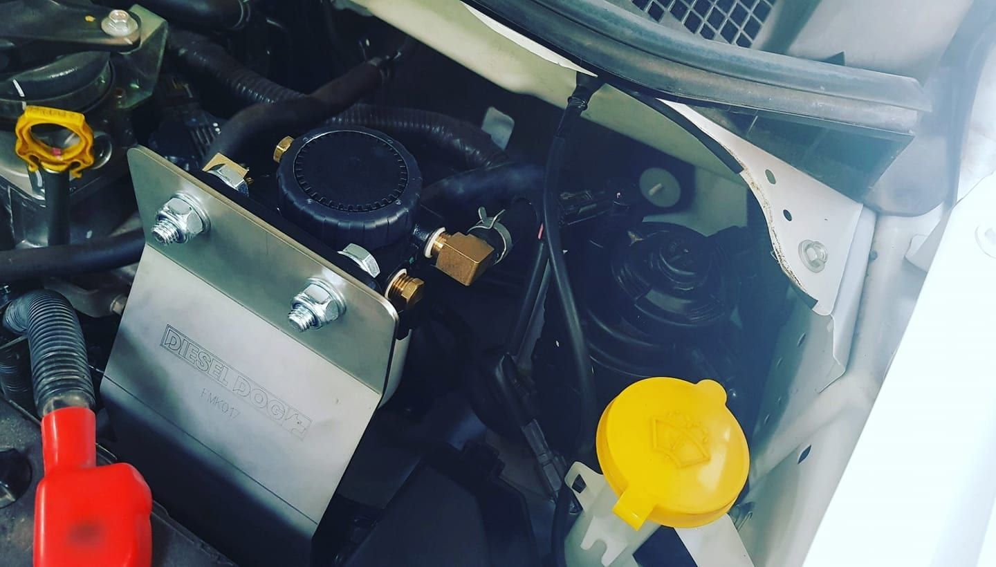 A Close Up Of The Underside Of A Car With A Battery And A Water Bottle — Goulburn Automotive Centre In Goulburn, NSW