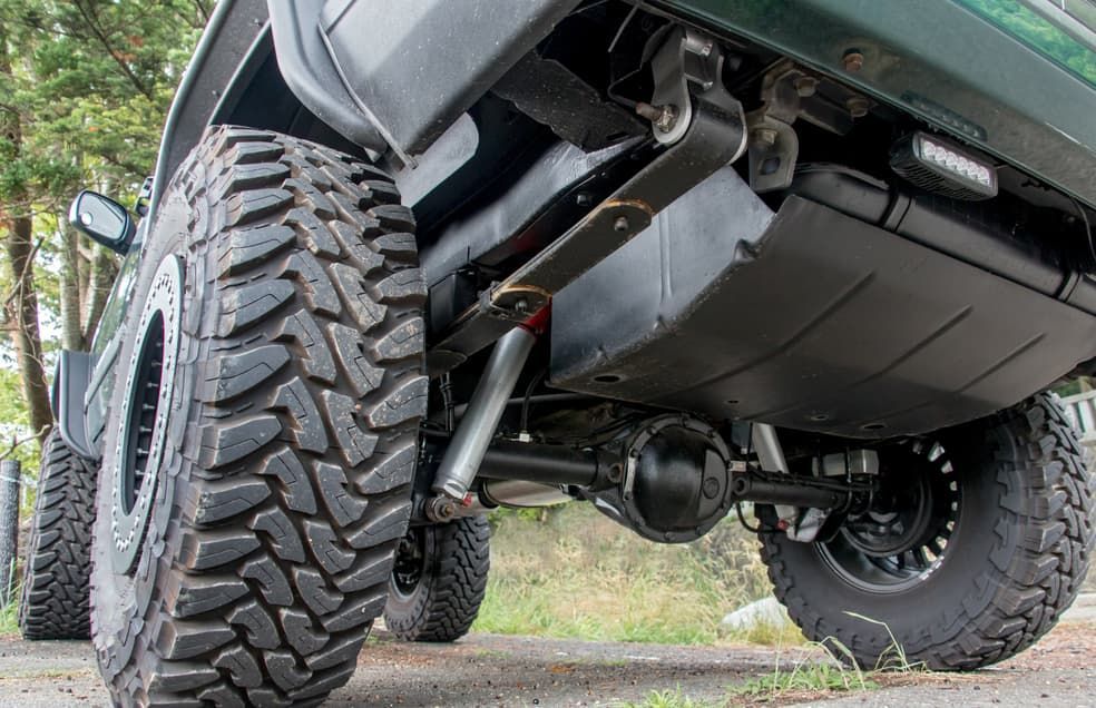 A Close Up Of The Underside Of A Truck With A Large Tire — Goulburn Automotive Centre In Goulburn, NSW
