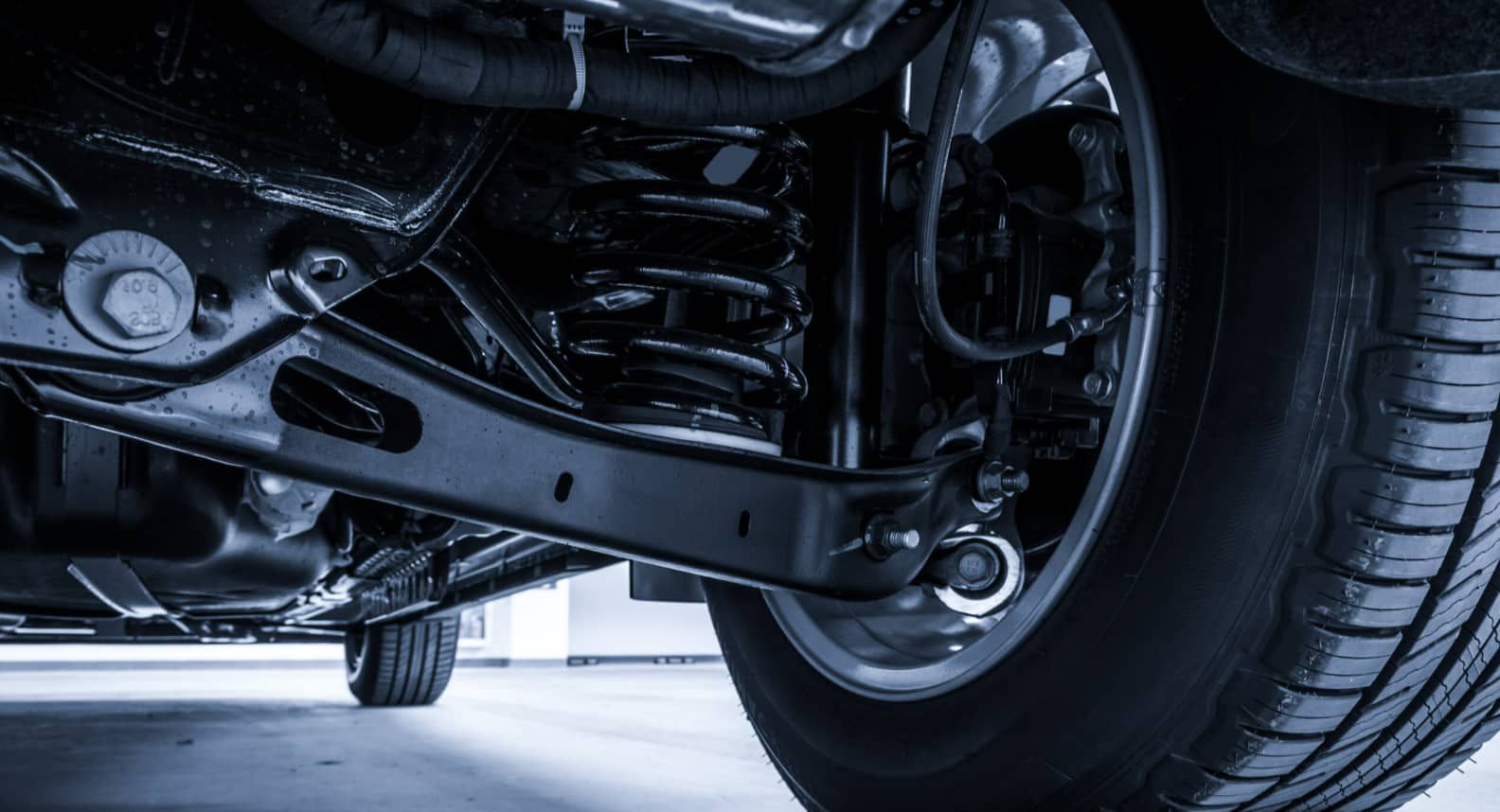 A Close Up Of The Underside Of A Car With A Tire — Goulburn Automotive Centre In Goulburn, NSW