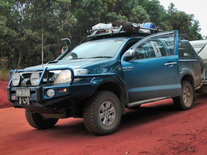 A Blue Toyota Hilux Is Parked On A Dirt Road — Goulburn Automotive Centre In Goulburn, NSW