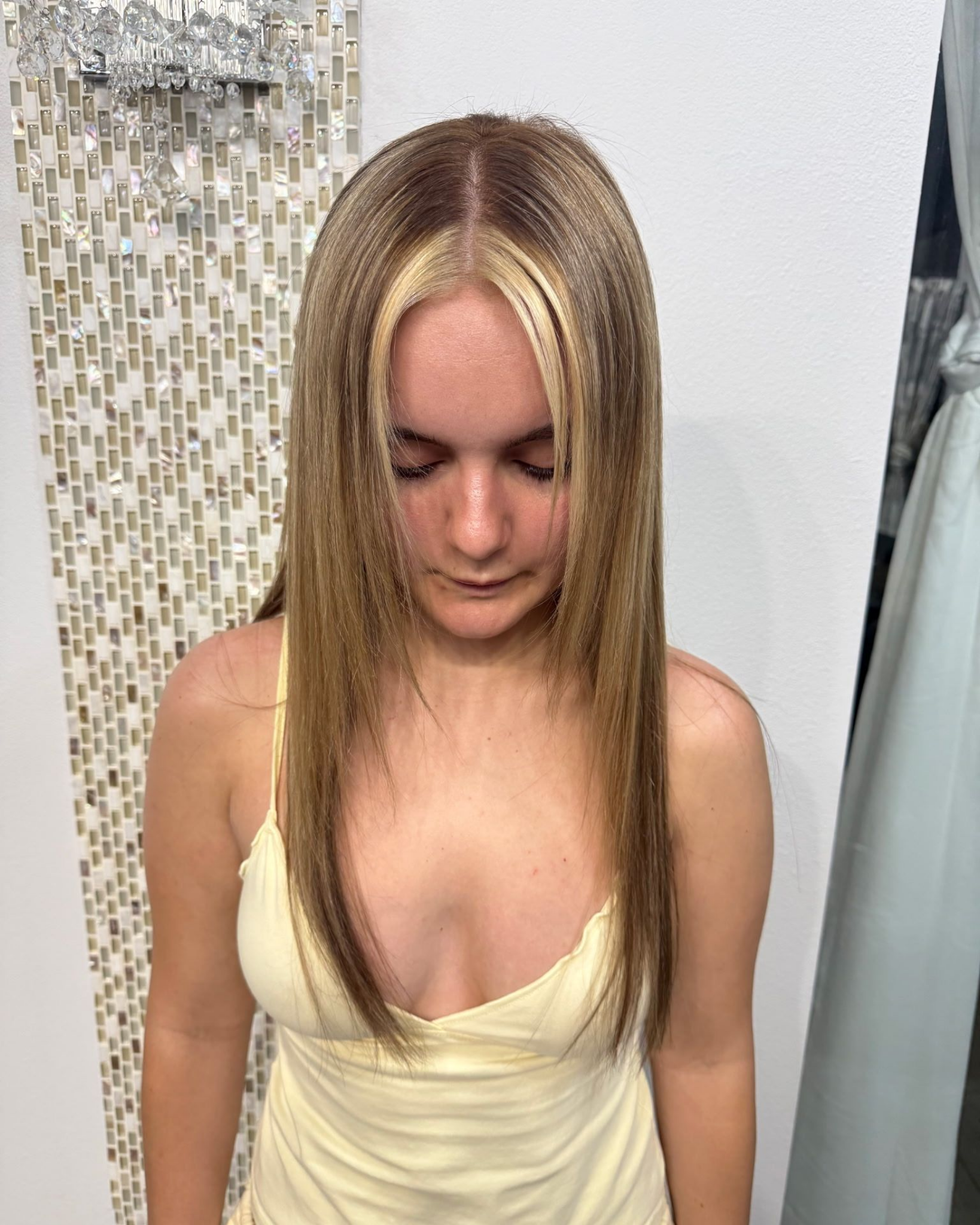 Long blonde, face-framing highlights, front view