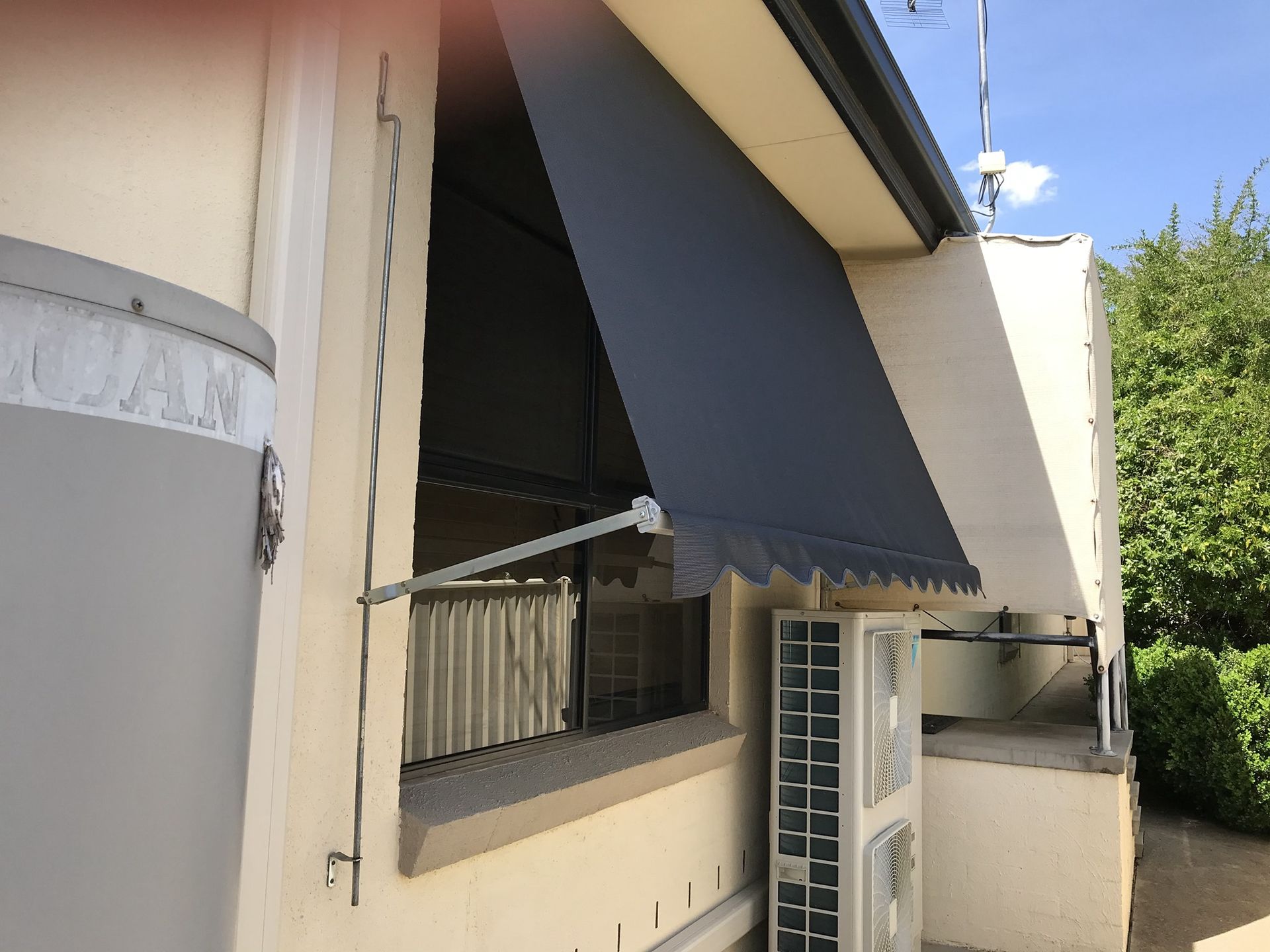 Apartment Balcony with Black Awning — Tamworth Blinds & Awnings in Gunnedah, NSW