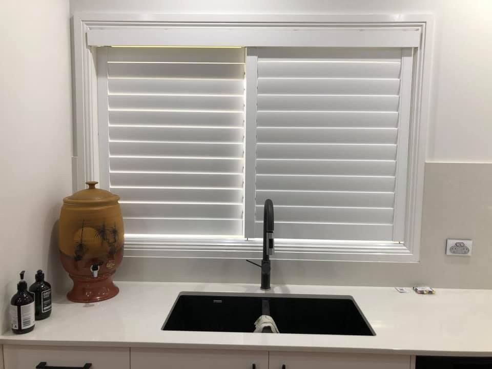 Kitchen Sink Under a Window with White Blinds — Tamworth Blinds & Awnings in Quirindi, NSW