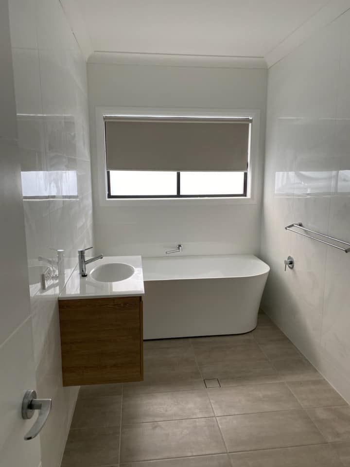 Modern Bathroom with White Tiled Walls and Windows with Blinds — Tamworth Blinds & Awnings in Tamworth, NSW