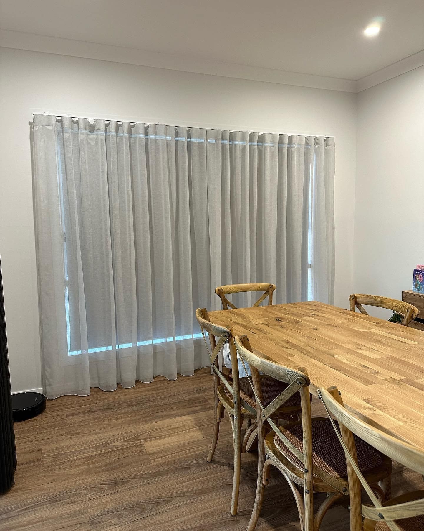 Dining Room with Wooden Table and Curtains — Tamworth Blinds & Awnings in Gunnedah, NSW