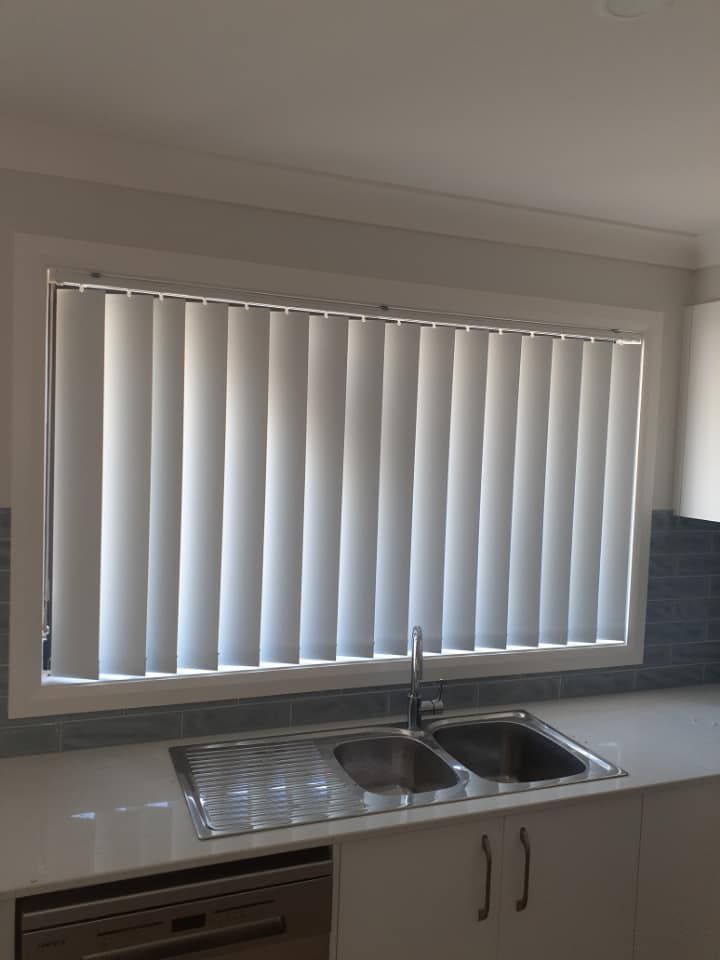 Kitchen Sink Beneath a Window with White Vertical Blinds — Tamworth Blinds & Awnings in Narrabri, NSW