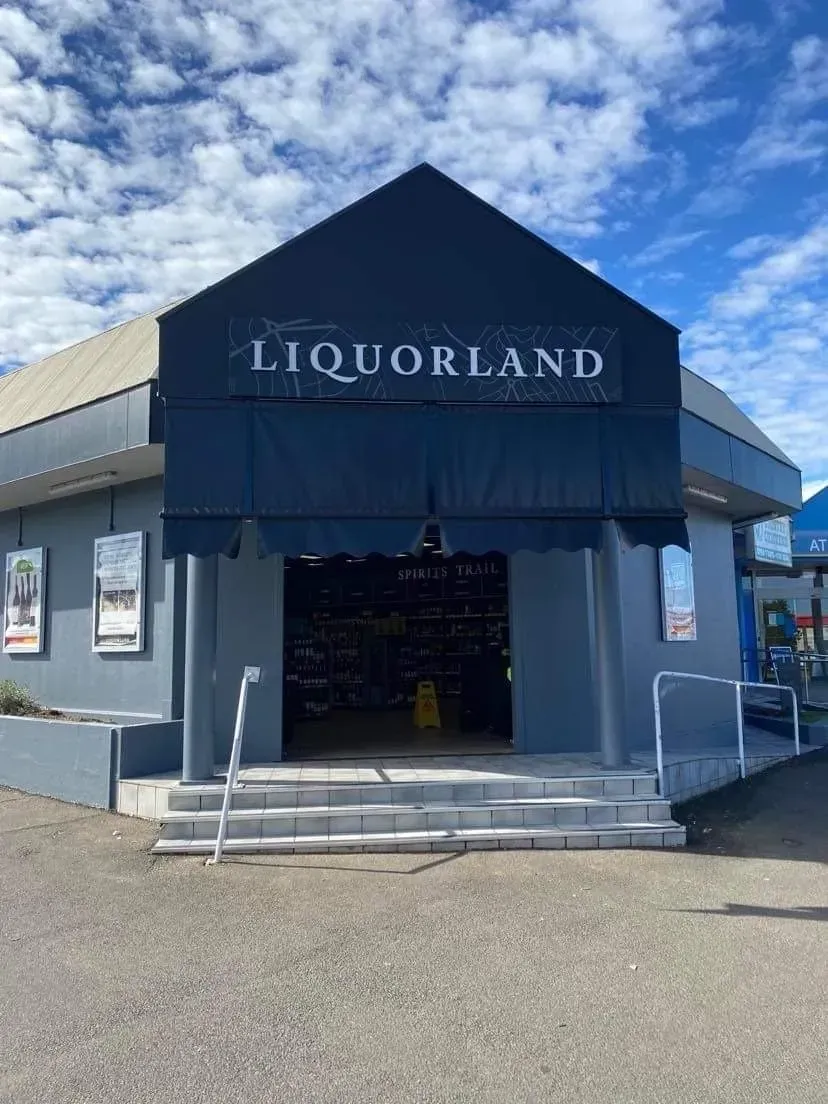 Liquorland Storefront with Blue Awning and Open Entrance — Tamworth Blinds & Awnings in Tamworth, NSW