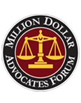 Million Dollar Advocates Forum logo with gold scales on a black circular seal