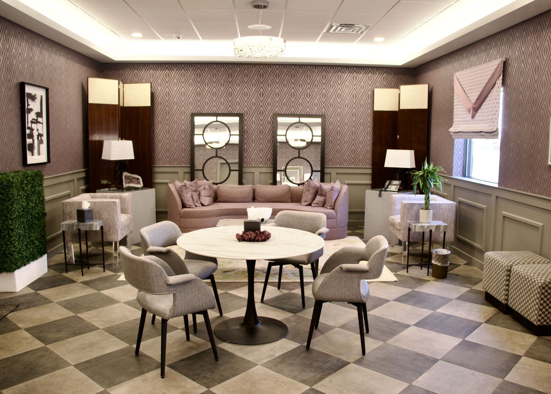 A living room filled with furniture and a checkered floor.
