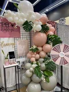 Organic balloon garland neutral colors weddings events. live botanicals in balloon garland Beverly hills