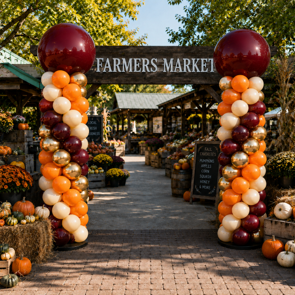 Classic balloon columns orange gold burgundy cream fall famers market event Manhattan beach