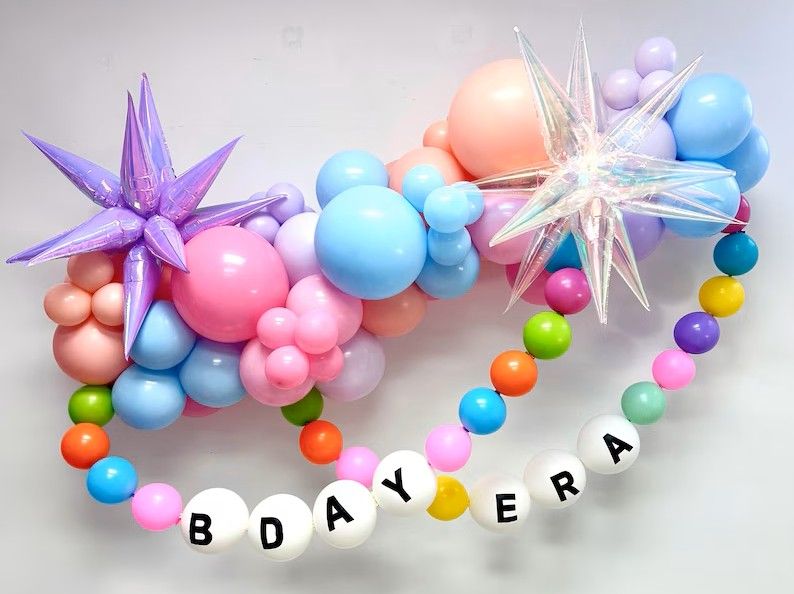 Friendship Bracelet Organic Balloon Garland wall install. summer colors for kids birthday party Los Angeles