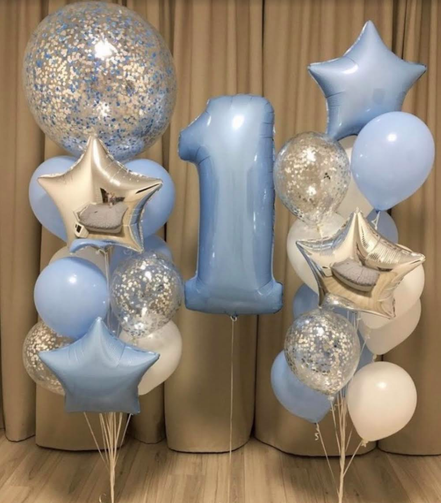Blue and silver balloon arrangements for a first birthday, with a large number 