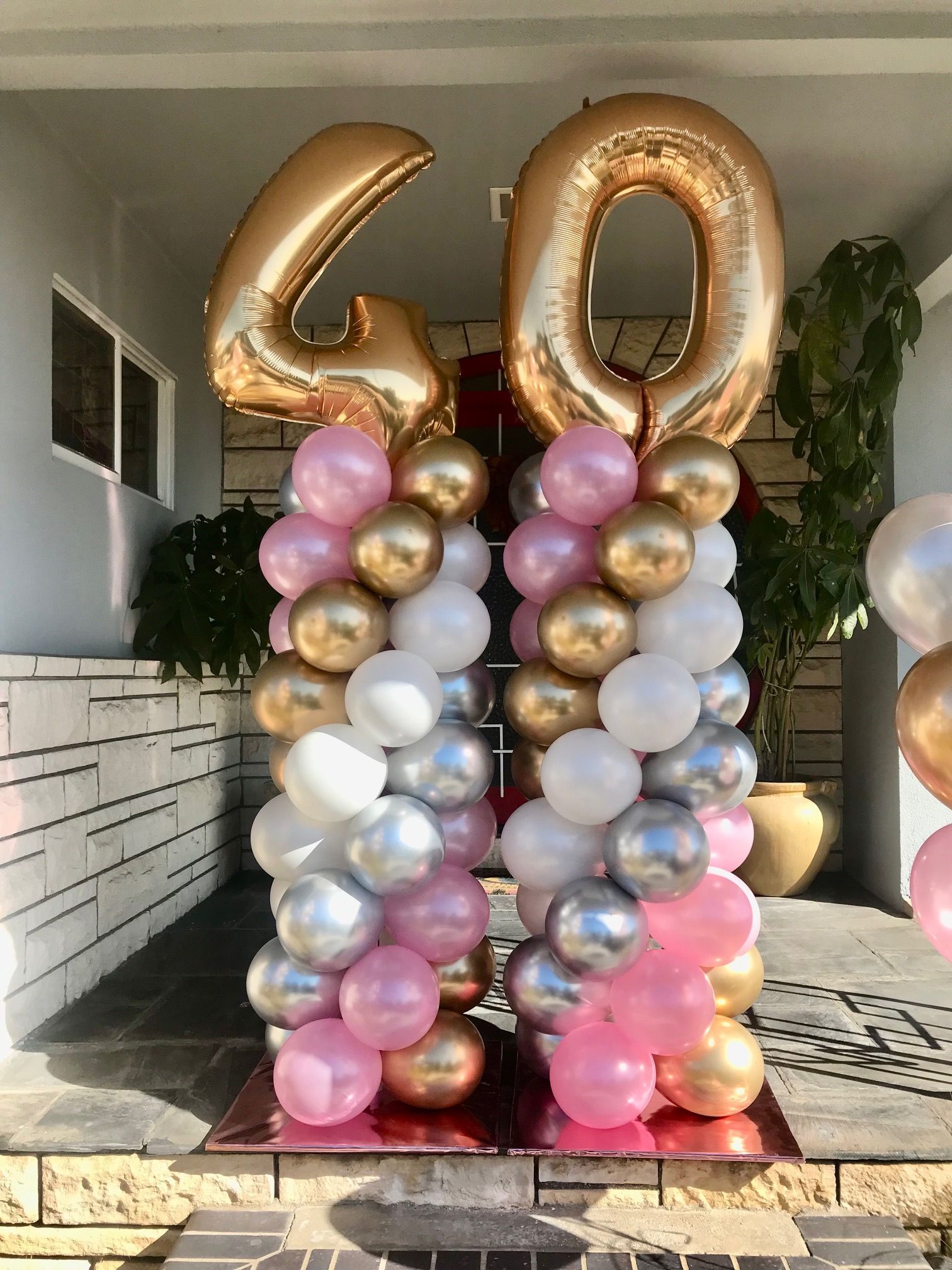 Two balloon columns with gold 