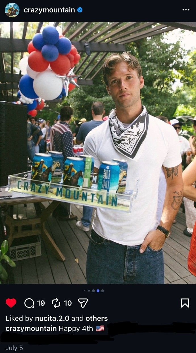 Crazy Mountain repost of a model holding a tray of branded drinks on the patio, with red, white and blue organic balloon garlands on the overhang above