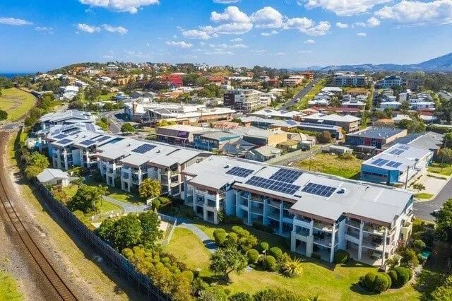 Aerial View of Apartment Complex With Solar Panels — Ground Control Property Maintenance In North Boambee Valley, NSW