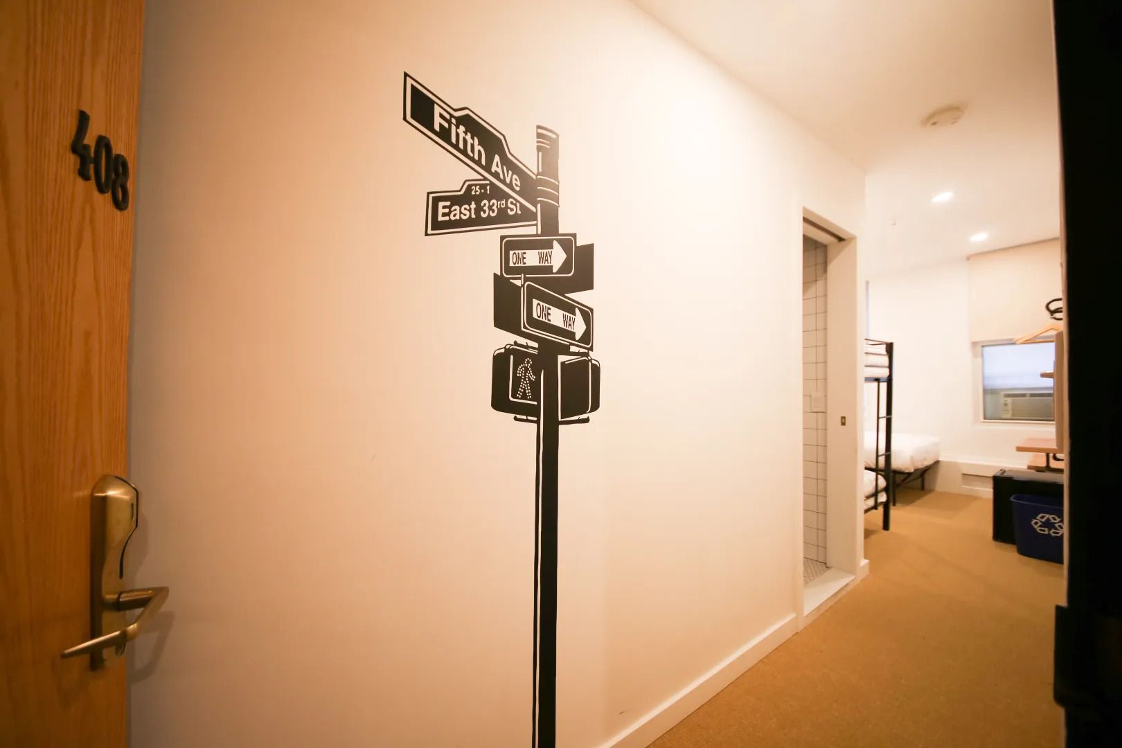 A hallway with a street sign on the wall