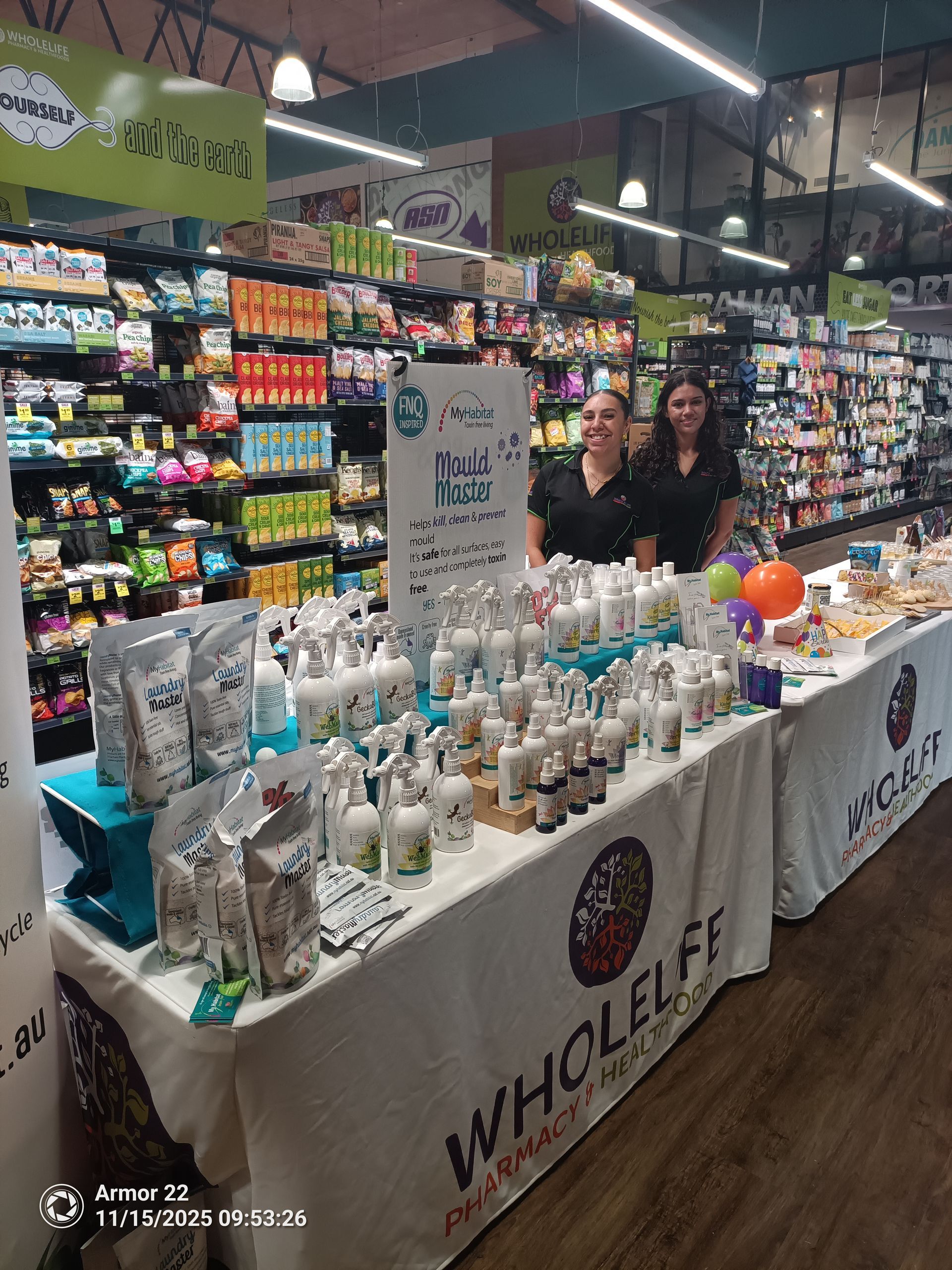 Market Booth With Rows of White Bottles — My Habitat Products in Malanda, QLD