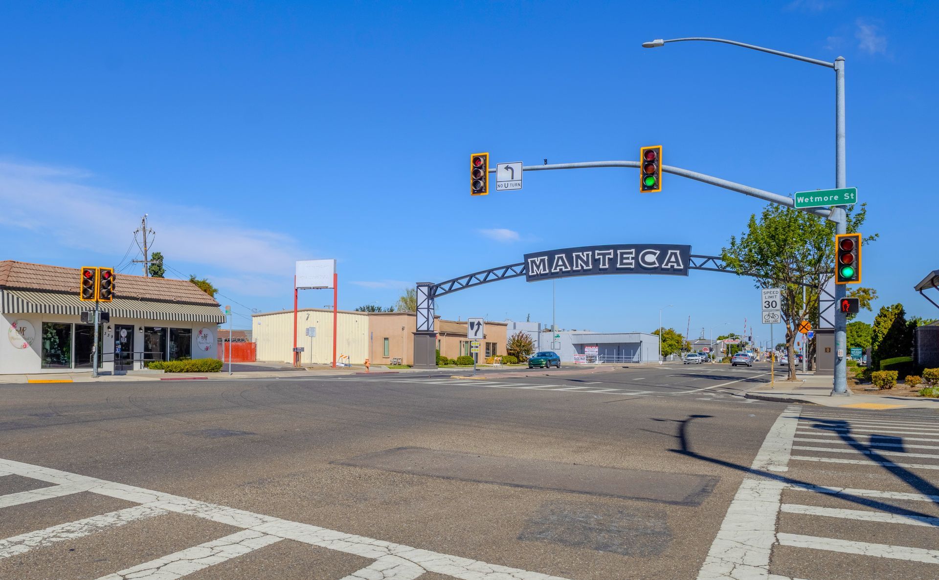 Manteca gateway arch sign at Wetmore Street intersection, Manteca, CA
