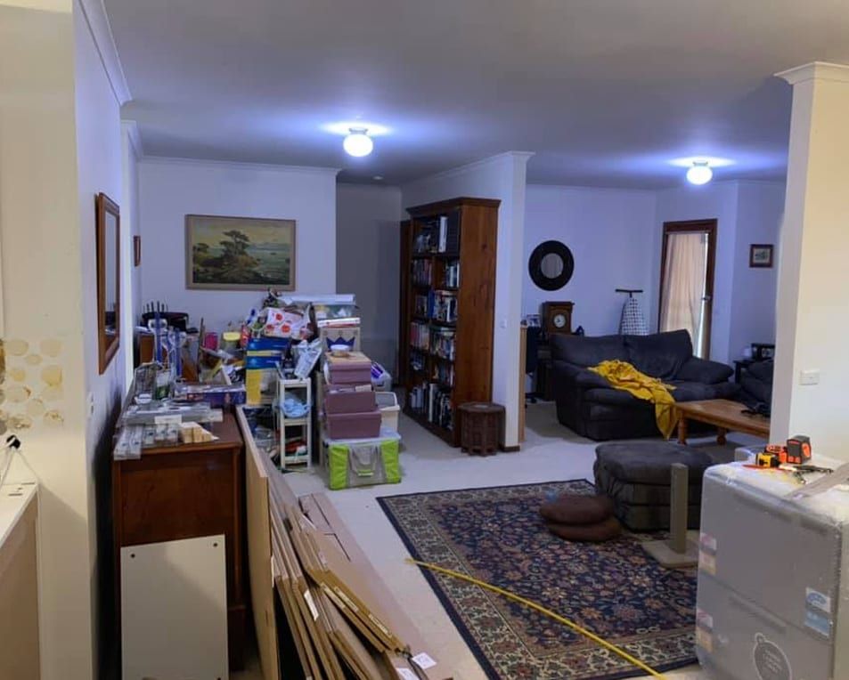 A living room filled with furniture and a couch.