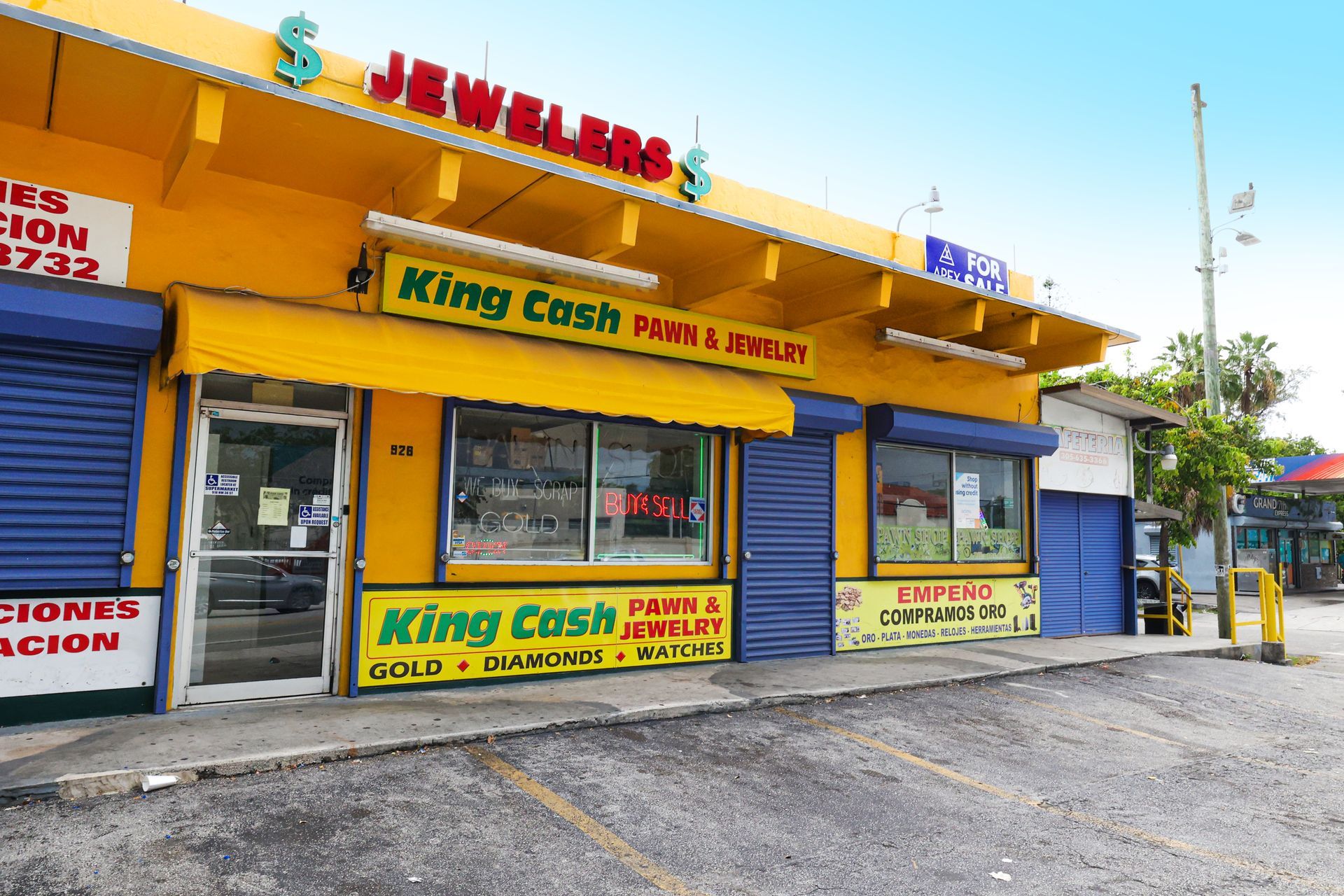 Exterior view of King Cash Pawn & Jewelry store on Miami 36th St. with yellow facade, red 