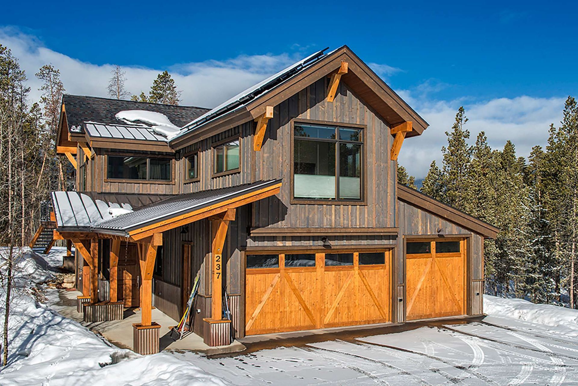wood house with two garage door