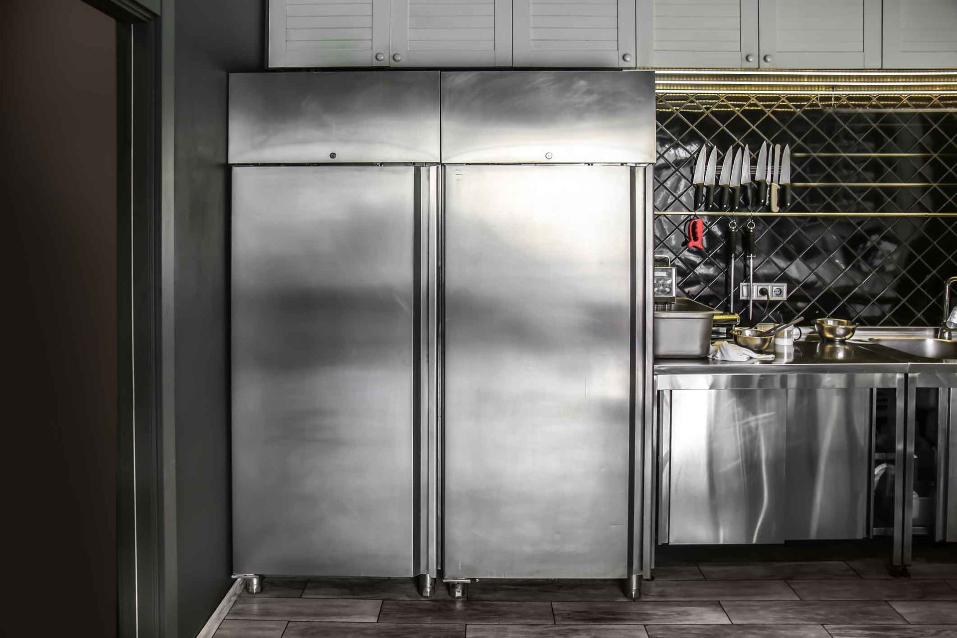 Well-maintained equipment in a restaurant kitchen, showcasing commercial refrigeration service.