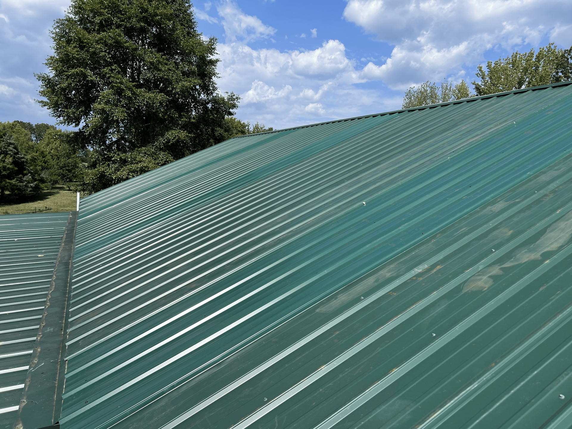 Green Metal Roofing by Red Line Roofing in Dickson, TN