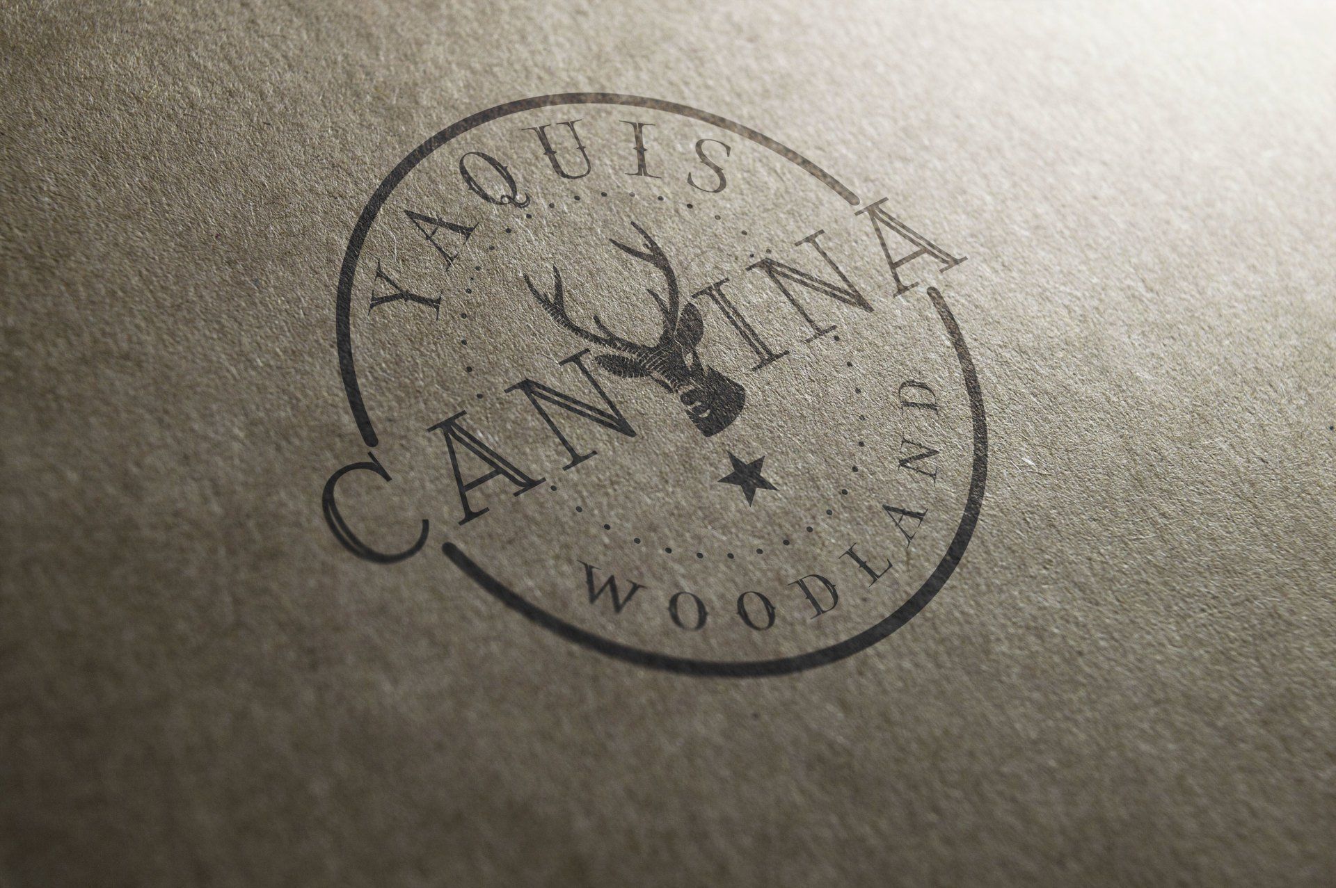 Logo for Yaquis Cantina Woodlands, featuring a deer head within a circular border.