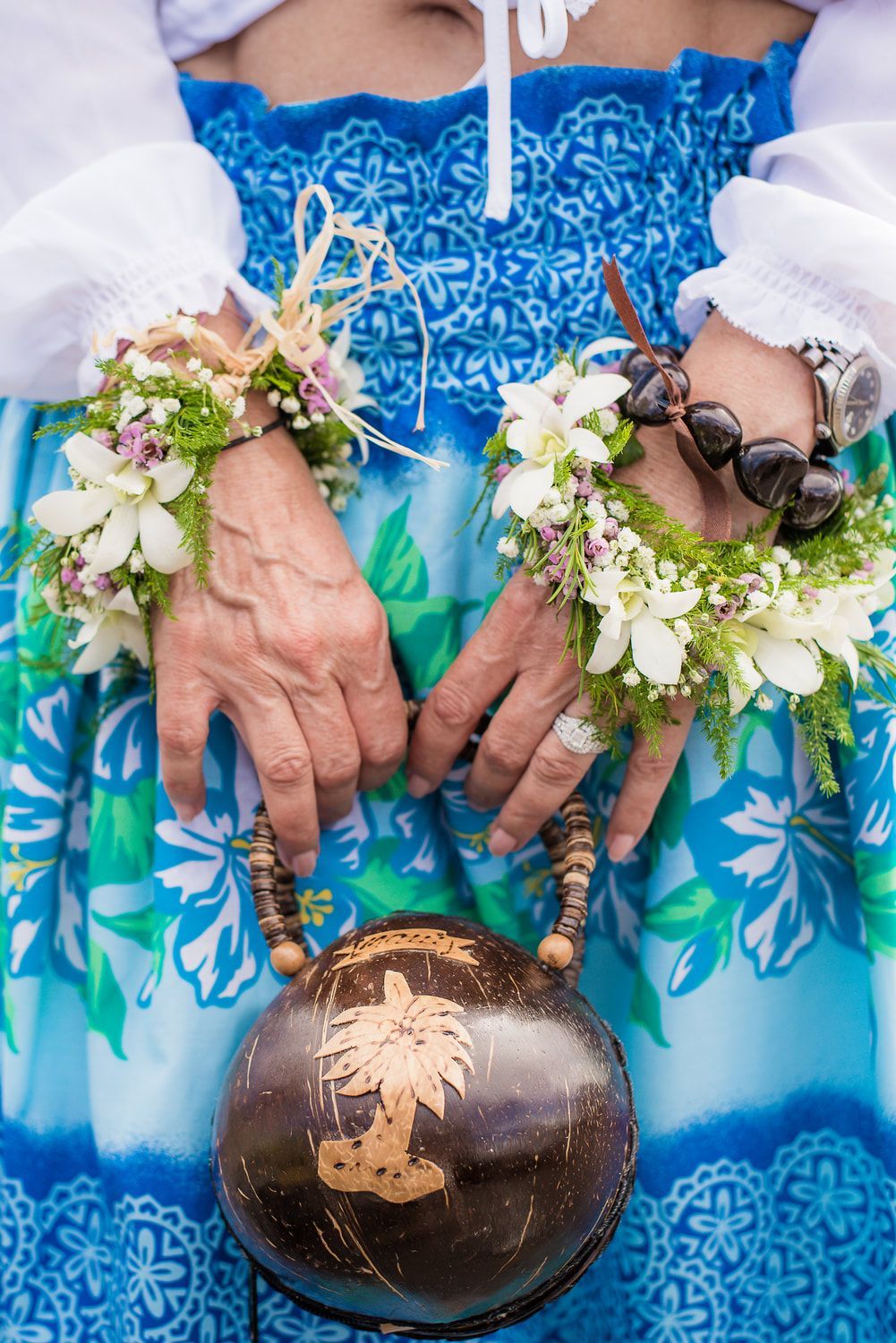 Wedding ceremony on the beach by Simple Kona Beach Weddings, officiant with couple, leis, ocean background.