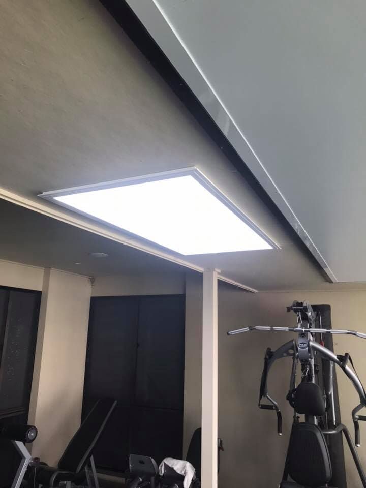 A Gym With A Large Light On The Ceiling — GJT Electrical In Warners Bay, NSW