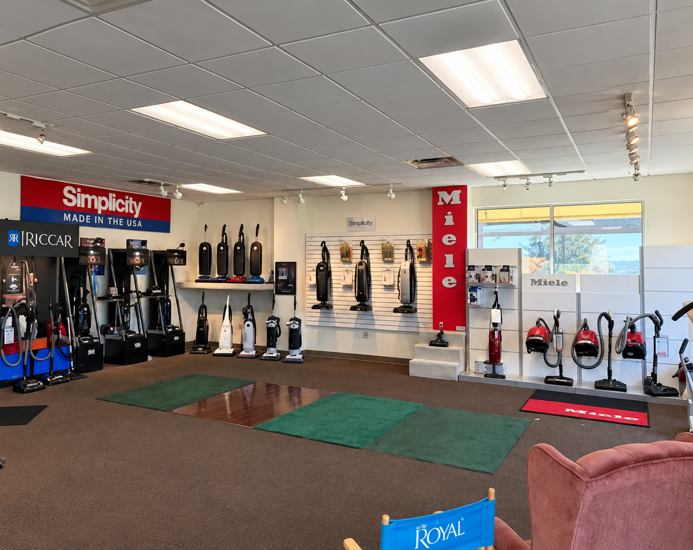 Fitness equipment showroom with treadmills, ellipticals, and exercise bikes on display