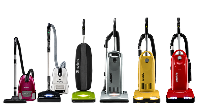 Six upright vacuum cleaners in pink, white, black, silver, yellow, and red on a white background