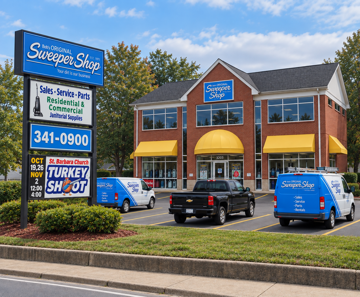 Two-story storefront with blue-and-yellow awnings and parked vans under a sunny sky