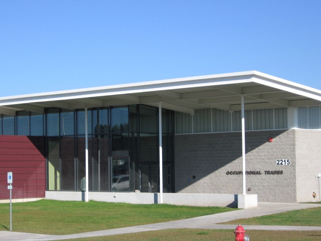 A large building with a fire hydrant in front of it