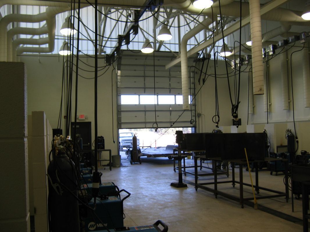 The inside of a building with a large garage door