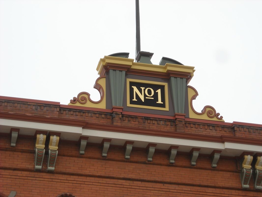 A brick building with a sign on top that says no 1