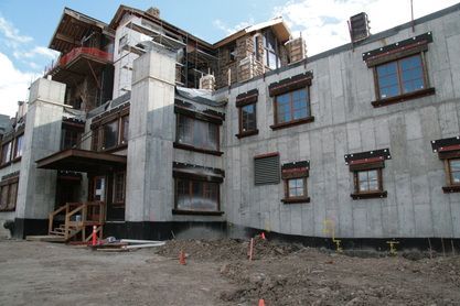 A large building under construction with a lot of windows