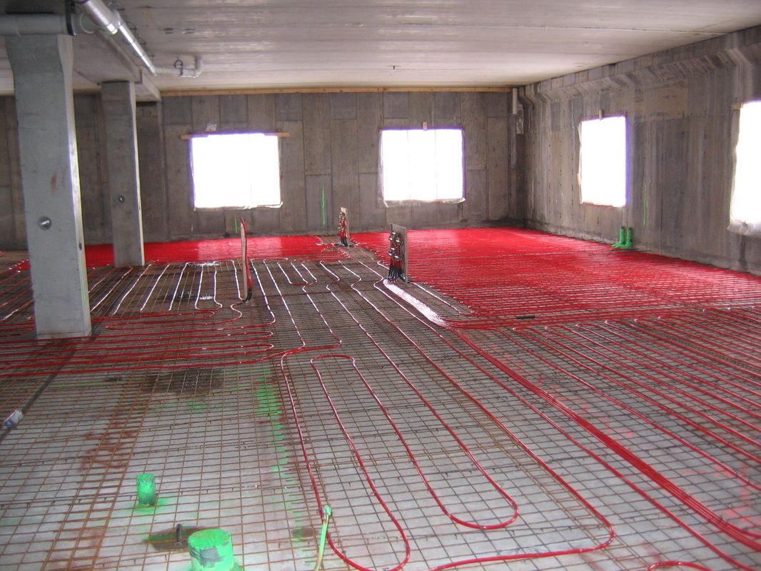 A large room with a lot of wires on the floor.