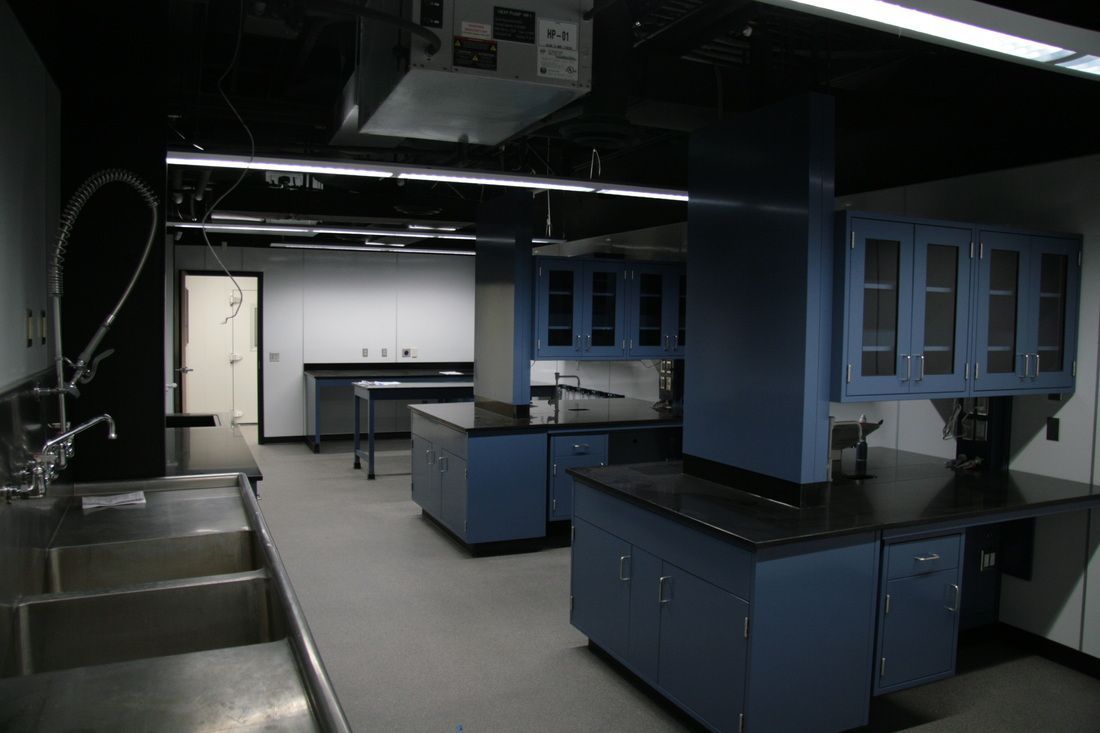 A kitchen with blue cabinets and a sink