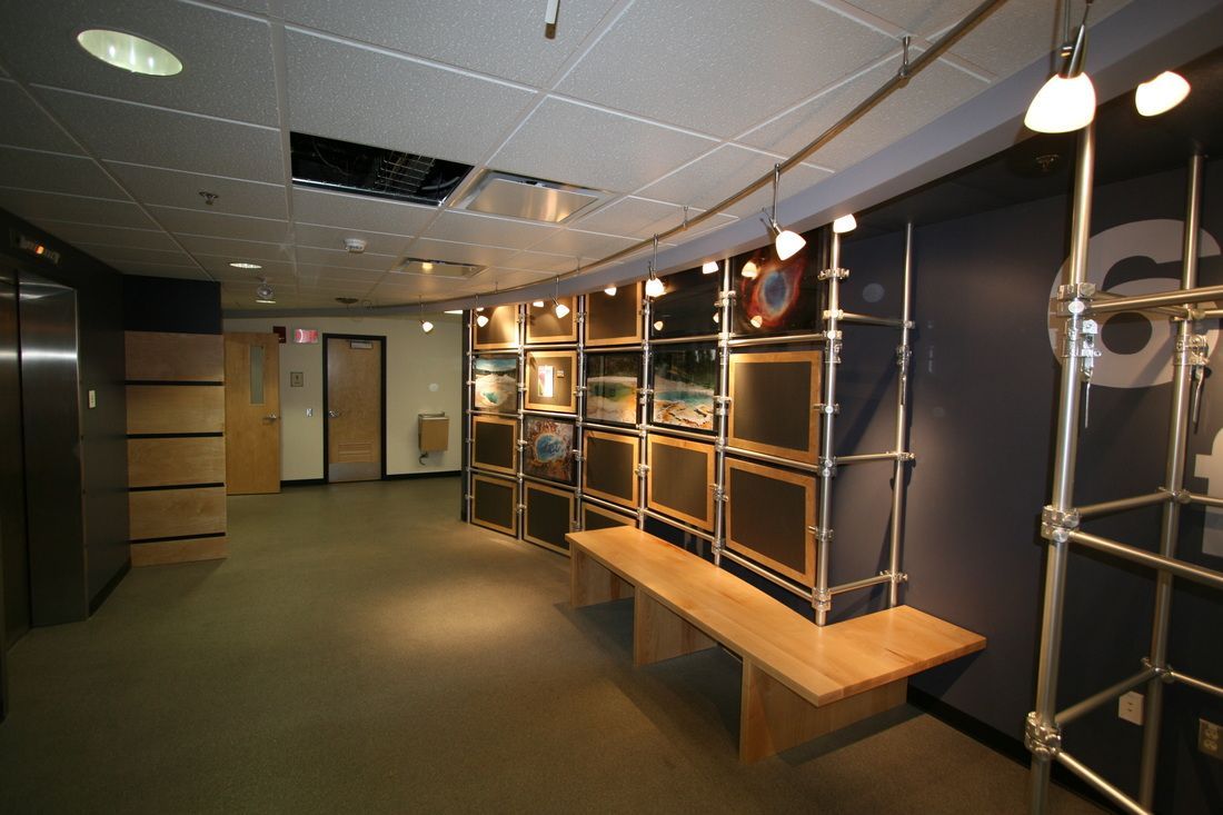 An empty hallway with a wooden bench and shelves