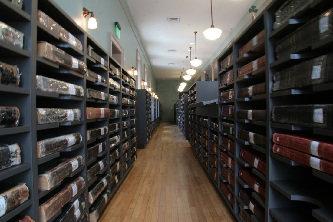 A library filled with lots of books including one that says ' a ' on it