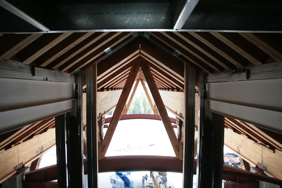 Looking up at the ceiling of a building with a triangle in the middle