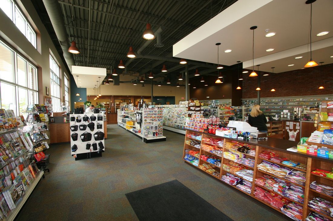 The inside of a grocery store with lots of shelves
