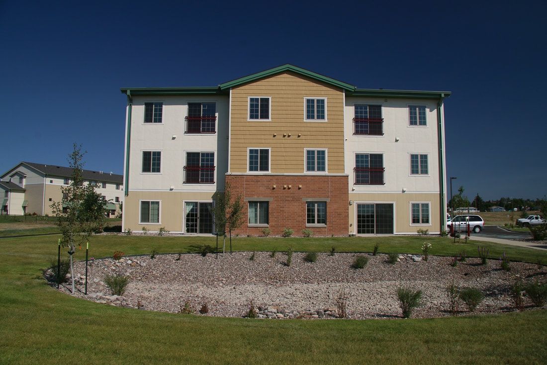 A large apartment building with a lot of windows